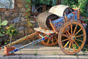 Traditional coloured sicilian cart with 2 wooden barrels