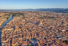 Aerial view of Florence cityscape with view of Florence Cathedral - Cathedral Santa Maria del Fiore and arno river.