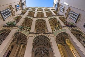 A low angle shot of Palazzo dello Spagnolo in Rione Sanita, Naples, Italy